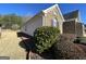 The side of the home shows brick and siding with manicured landscaping at 509 Carleton Pl, Locust Grove, GA 30248