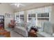 Cozy sun room with many windows, providing natural light and scenic views at 509 Carleton Pl, Locust Grove, GA 30248