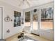 Bright sun room featuring large windows and a ceiling fan at 509 Carleton Pl, Locust Grove, GA 30248
