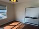 Sunlit bedroom with hardwood floors, window with blinds, and bright lighting at 19201 Waldrop Cv, Decatur, GA 30034