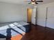 Bedroom with hardwood floors and neutral walls at 19201 Waldrop Cv, Decatur, GA 30034