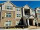 Multi-Gathering building with brick and siding, covered porch and yellow shutters at 19201 Waldrop Cv, Decatur, GA 30034