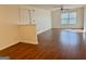 Open living room with hardwood floors, ceiling fan, and natural light at 19201 Waldrop Cv, Decatur, GA 30034