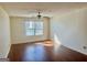 Bright living room with hardwood floors, ceiling fan and large window at 19201 Waldrop Cv, Decatur, GA 30034