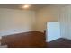 Living room with hardwood floors, white walls, and ample lighting at 19201 Waldrop Cv, Decatur, GA 30034