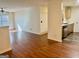 Open living room featuring hardwood floors and view of the kitchen at 19201 Waldrop Cv, Decatur, GA 30034