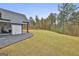 Manicured lawn and landscaped backyard offers a serene outdoor space at 285 Hogan Coweta Rd, Hogansville, GA 30230