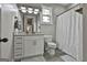 Bright, updated bathroom with white vanity, granite countertop and a shower and tub at 285 Hogan Coweta Rd, Hogansville, GA 30230