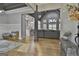 Open concept living area with hardwood floors, neutral color palette, and views to the kitchen at 285 Hogan Coweta Rd, Hogansville, GA 30230