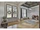 Bright entryway with wood floors, wainscoting detail, French doors, and modern ceiling at 285 Hogan Coweta Rd, Hogansville, GA 30230