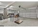 Spacious three car garage features storage space, overhead lighting, and a view to the exterior at 285 Hogan Coweta Rd, Hogansville, GA 30230