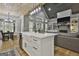Spacious kitchen with island, stainless steel appliances, and a view into the living area with fireplace at 285 Hogan Coweta Rd, Hogansville, GA 30230
