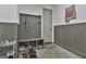 Hall tree and storage with an Auburn logo on the wall in this convenient mudroom at 285 Hogan Coweta Rd, Hogansville, GA 30230