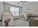 bedroom with two canvas teepees, neutral carpeting and a ceiling fan at 285 Hogan Coweta Rd, Hogansville, GA 30230