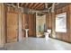 Partially finished basement with paneled walls and a shower area allows for easy customization to your needs at 205 Castlewood Rd, Tyrone, GA 30290