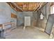 Large unfinished basement features block walls, wood ceilings, and potential for storage or customization at 205 Castlewood Rd, Tyrone, GA 30290