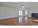 Spacious bedroom featuring hardwood floors, ceiling fan and a door leading to the bathroom at 205 Castlewood Rd, Tyrone, GA 30290