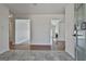 Bright foyer showcasing tile flooring, hardwood floors, and seamless transitions at 205 Castlewood Rd, Tyrone, GA 30290