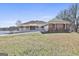 Attractive brick house with large front yard, convenient driveway, and tranquil lake view at 205 Castlewood Rd, Tyrone, GA 30290