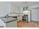 Updated kitchen with stainless steel appliances, tile flooring, and ample cabinet storage at 205 Castlewood Rd, Tyrone, GA 30290