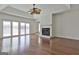 Bright living room with hardwood floors, fireplace and sliding doors to the outside at 205 Castlewood Rd, Tyrone, GA 30290
