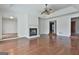 Inviting living room featuring hardwood floors, fireplace, and a ceiling fan at 205 Castlewood Rd, Tyrone, GA 30290