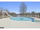 Beautiful backyard pool and slide providing a luxurious outdoor experience for relaxation and recreation at 205 Castlewood Rd, Tyrone, GA 30290