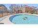 Sparkling pool with a well-maintained surrounding and a serene backyard provides a relaxing outdoor escape at 205 Castlewood Rd, Tyrone, GA 30290