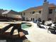 Backyard featuring a swimming pool, a patio with outdoor furniture, and a well-maintained lawn at 4683 Derby Loop, Fairburn, GA 30213