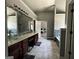 Bathroom featuring a double vanity, garden tub, and tiled floors at 4683 Derby Loop, Fairburn, GA 30213