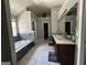 Bathroom featuring a double vanity, garden tub, and tiled floors at 4683 Derby Loop, Fairburn, GA 30213