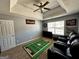 Bedroom featuring fan, theme area rug, window, and four leather reclining chairs at 4683 Derby Loop, Fairburn, GA 30213