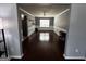 Open-concept dining room with hardwood floors and decorative molding leading to the kitchen at 4683 Derby Loop, Fairburn, GA 30213