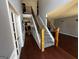 Welcoming foyer with hardwood floors, a staircase, and high ceilings with decorative molding at 4683 Derby Loop, Fairburn, GA 30213