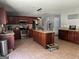 Spacious kitchen with tile floors, granite countertops, and a functional center island at 4683 Derby Loop, Fairburn, GA 30213