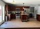Well-equipped kitchen with tile floors, stainless steel appliances, and center island at 4683 Derby Loop, Fairburn, GA 30213