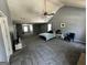 Large living room featuring bed, fan, fireplace, and plenty of open space at 4683 Derby Loop, Fairburn, GA 30213