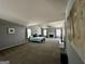 Spacious living room area with bed, fireplace, ceiling fan and light gray color scheme at 4683 Derby Loop, Fairburn, GA 30213