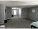 Spacious living room area with bed, fan and light gray color scheme at 4683 Derby Loop, Fairburn, GA 30213