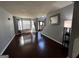 Bright living room with hardwood floors, large windows, and neutral color palette at 4683 Derby Loop, Fairburn, GA 30213