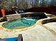Backyard features a swimming pool, a patio with outdoor furniture, and a well-maintained lawn at 4683 Derby Loop, Fairburn, GA 30213