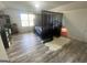 Serene bedroom featuring a dramatic canopy bed, a faux fur rug, and ample space, creating a relaxing retreat at 6365 Wellington Walk Way, Lithonia, GA 30058