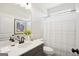 Bathroom with a single vanity, framed mirror and a shower with a tub at 10465 Trellis Lane (Lot 26), Hampton, GA 30228