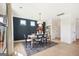 Cozy dining area with modern chandelier, seating for six, and large windows at 10465 Trellis Lane (Lot 26), Hampton, GA 30228