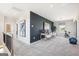 Spacious upstairs hallway with neutral carpet, art, and a dedicated office space at 10465 Trellis Lane (Lot 26), Hampton, GA 30228