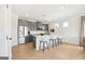 Stylish kitchen featuring an island with seating, stainless steel appliances, and plentiful storage at 10465 Trellis Lane (Lot 26), Hampton, GA 30228