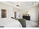 Comfortable main bedroom with tray ceilings, modern lighting, and walk-in closet at 10465 Trellis Lane (Lot 26), Hampton, GA 30228