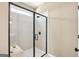 Modern shower with glass enclosure, tiled walls, and a built-in bench at 10465 Trellis Lane (Lot 26), Hampton, GA 30228
