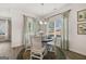 Bright dining area with a round table, natural light, and views of the backyard at 10471 Trellis Lane (Lot 25), Hampton, GA 30228