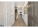 Inviting entryway with wood-look flooring, white wainscoting, and view of the staircase and open floor plan at 10471 Trellis Lane (Lot 25), Hampton, GA 30228